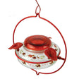 Nature's Way Decorative Top-Fill Glass Hummingbird Feeder, Crimson Corsage, featuring a glass container with red rim, three feeding ports, and lifelike flower designs for easy cleaning and refilling.