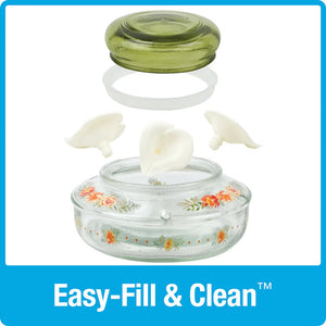 Nature's Way Decorative Top-Fill Glass Hummingbird Feeder, Gardenia Bouquet, with clear glass dish and green lid open for easy filling and cleaning.