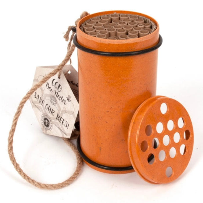 Eco Bee Nester, a cylindrical container designed for solitary bees, features natural plant fibers and tubes for bees to lay eggs.