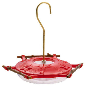 Red bird feeder with a hook on a white background