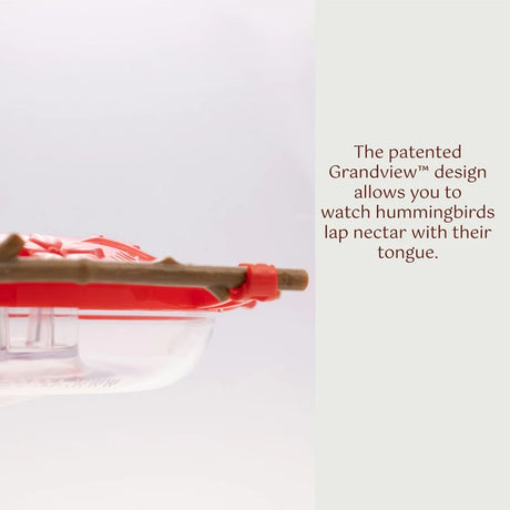 Bird feeder with red and clear design on a white background