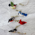 Felt American Birds Garland showcasing handcrafted felt bird ornaments hanging on a string, perfect for adding a whimsical, natural touch to home décor.