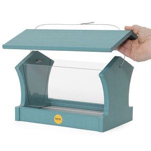 Hand holding a Large Hopper Bird Feeder, Lake Blue, with clear plexi-glass windows and a blue roof, designed to hold up to 4 lbs. of seed.