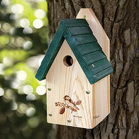 Garden Wren & Chickadee House mounted on a tree, featuring a laser-etched chickadee design, ventilation, drainage, and a side panel for easy cleaning.