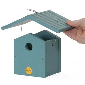 Hand holding a Lake Blue Wren Bird House with an open lid, showcasing its durable recycled plastic construction and 1-1/4 inch entrance hole.