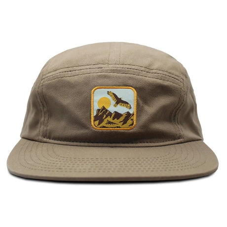 Bird Collective Hawkwatch Camp Hat featuring a Turkey Vulture soaring above mountain peaks, with an adjustable strap for a secure fit during outdoor adventures.