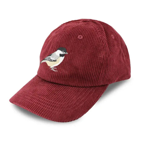 Chickadee Corduroy Hat, Burgundy: A burgundy six-panel baseball cap with a Black-capped Chickadee embroidery on the front, featuring a curved brim and adjustable strap.