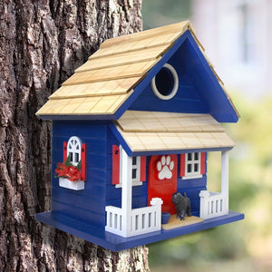 Bow Wow Birdhouse on a tree, designed for small birds, featuring a 1.25″ entrance, clean-out panel, and keyhole for easy hanging.