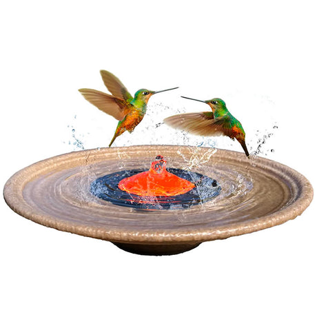 QuackUps Solar Bubbler Fountain with a red slotted dome and a hummingbird flying above, perfect for attracting and providing water for hummingbirds.