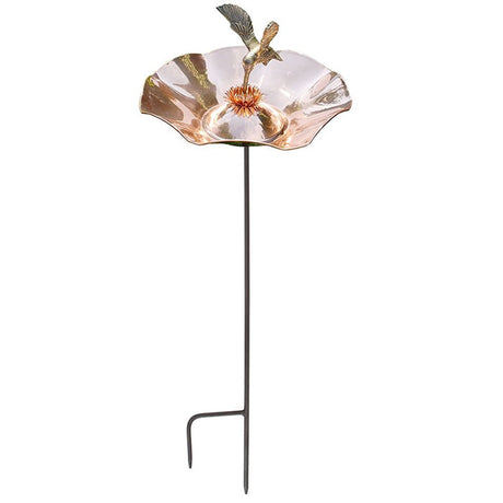 Hummingbird Bird Bath with Stake featuring a detailed hummingbird sipping nectar from a flower in the center of a copper-plated brass basin.