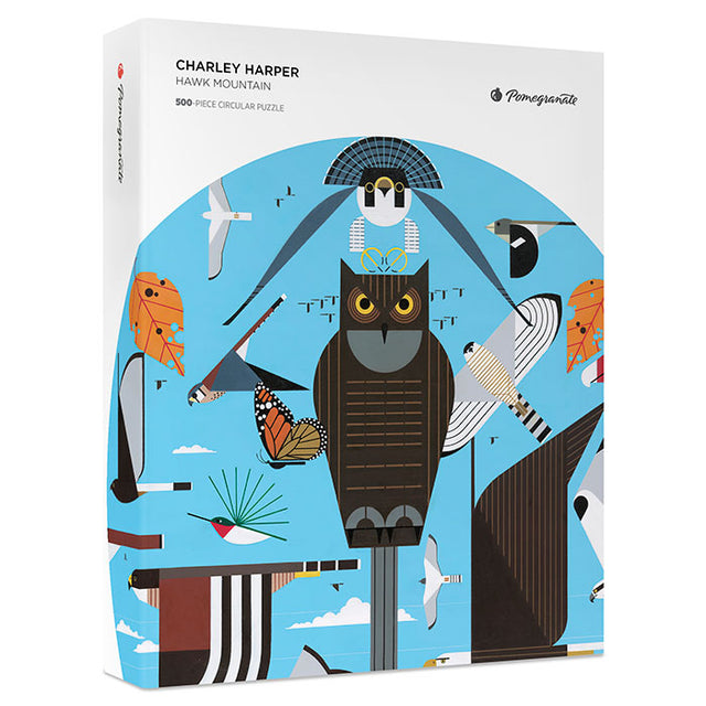 Charley Harper Hawk Mountain 500-Piece Circular Jigsaw Puzzle featuring an owl, hawks, and colorful birds in a naturalistic, cartoon-style illustration. Includes 8x10 inch reference insert.