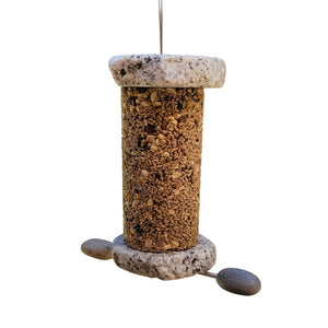 Sea Stones Lifetime Seed Cylinder Bird Feeder, handmade from reclaimed granite, featuring rocks and designed for easy refilling with standard 4 x 8 inch seed cylinders.