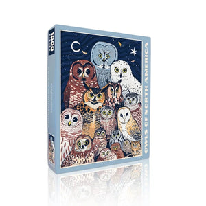 Owls of North America Puzzle box featuring illustrated collage of various owl species against a night sky, highlighting their diversity in a 1,000-piece set.