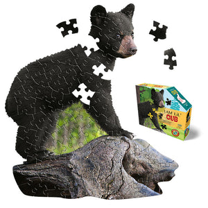 I Am Lil' Cub 100 pc. Puzzle: Animal-shaped jigsaw puzzle featuring a bear on a rock; includes educational booklet and poster.