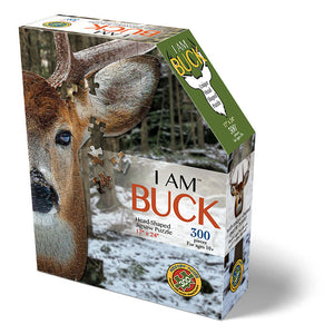 I Am Buck 300 pc. Puzzle: Box containing a 300-piece jigsaw puzzle featuring a deer head, packaged with educational Madd Capp Fun Facts.