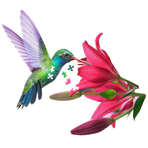 I Am Hummingbird 300 pc. Puzzle featuring a photo-realistic hummingbird eating a flower, with unique-shaped pieces and an educational facts booklet included.