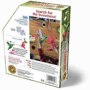 I Am Hummingbird 300 pc. Puzzle in a tamper-proof box, featuring animal-shaped pieces, educational booklet, and poster-size reference image.