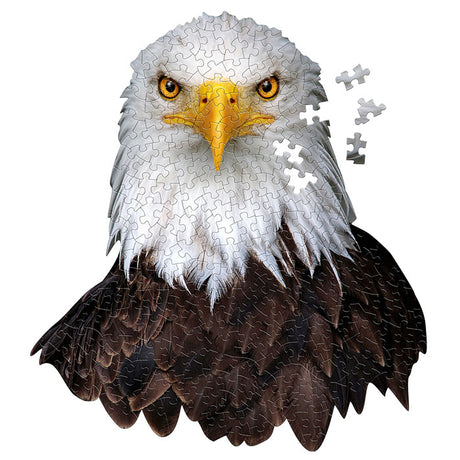 I Am Eagle 300 pc. Puzzle featuring a bald eagle, uniquely shaped with 300 pieces, includes a Madd Capp Fun Facts booklet and a reference image poster.