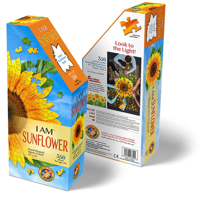 I Am Sunflower 350 pc. Puzzle in unique, floral-shaped packaging with an educational booklet and gardening tips, featuring a vibrant sunflower image on the box.