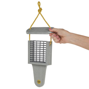 Hand holding the Modern Farmhouse Suet Feeder with Tail Prop, Driftwood, showcasing its sleek design and suet cake compartment for bird feeding.