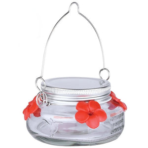 Nature's Way Mason Jar Hummingbird Feeder with red flower-shaped feeding ports, embossed hummingbird, stainless steel lid, and hanger.