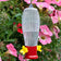 Garden Stake Hummingbird Feeder & Hanging Rod, featuring a clear plastic cup with 2 feeding ports and built-in bee guard, set in a garden planter.