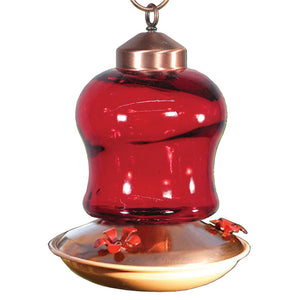 14 oz. Ruby Glass Hummingbird Feeder with red glass reservoir, four metal flower-shaped feeding ports, and a flat base for easy filling and cleaning.