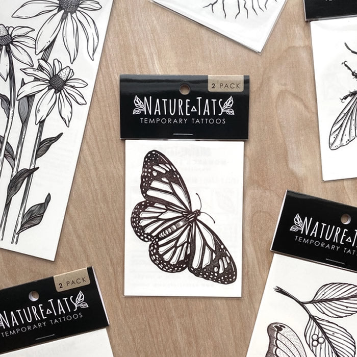 Monarch Butterfly Temporary Tattoo: Hand-drawn design featuring bold black lines, showcasing a detailed monarch butterfly. Easy to apply and remove, lasting 2-5 days.