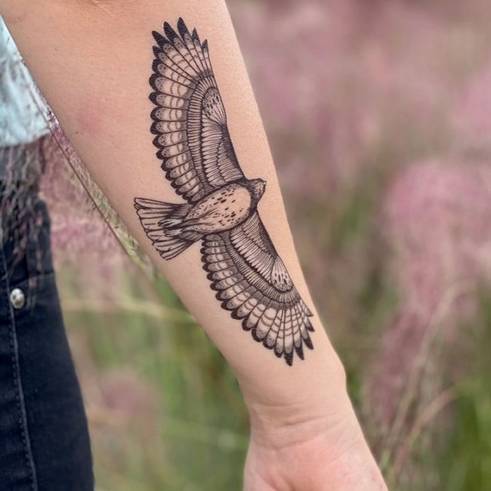 Hawk Temporary Tattoo: A detailed, 6.5-inch Red-Tailed Hawk tattoo on a person's arm, showcasing intricate design and nature-inspired art.