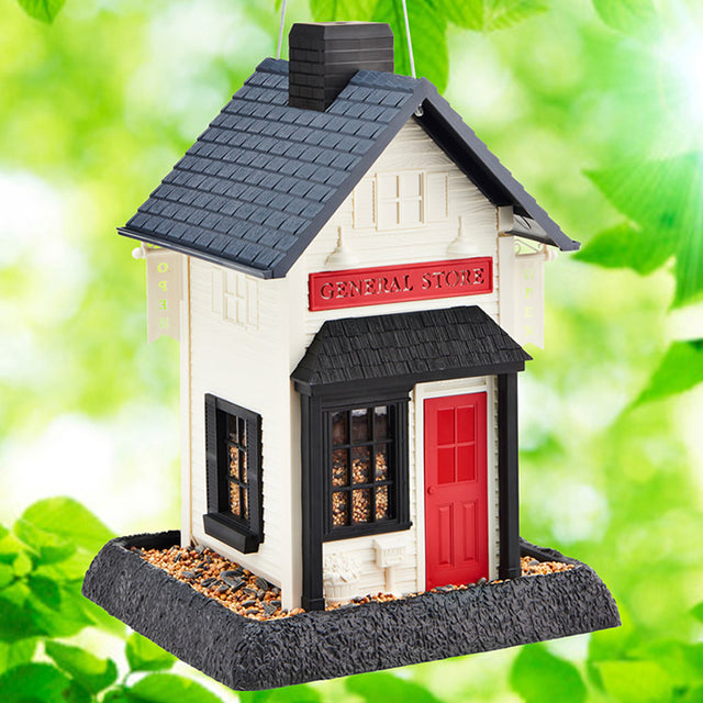 North States General Store Bird Feeder with red door, black roof, OPEN sign, mailbox, and flowerpot. Dual feeding trays, easy to refill and clean.