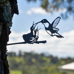 Metal Hummingbird & Chicks sculpture: A detailed metal art piece of a hummingbird feeding its chicks, ready to be tapped into a tree or fence.