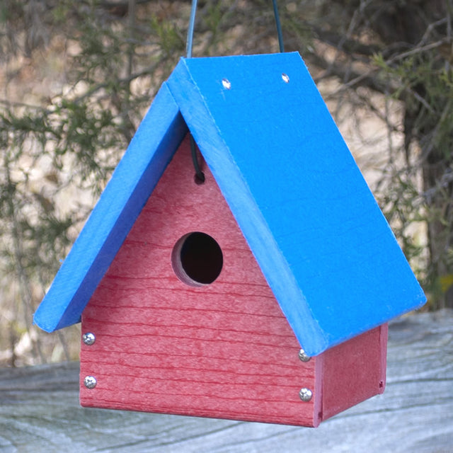 Going Green™ A-Frame Wren/Chickadee House with blue roof, metal mesh flooring, and lift-up roof, hanging from a tree.