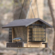 Going Green® Contemporary Deluxe Ranch Feeder with Suet Feeders, featuring a bird perched on a feeder, showcasing feeding trays, suet holders, and a protective roof.