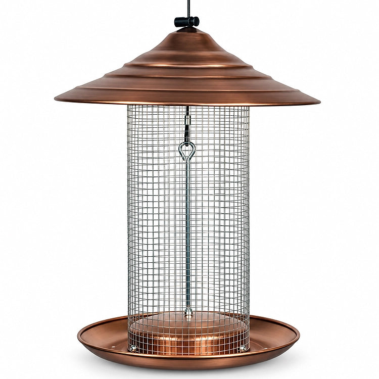 Copper sunflower seed bird feeder with a silver wire mesh tube, wide tiered roof, and circular seed tray on a white background.