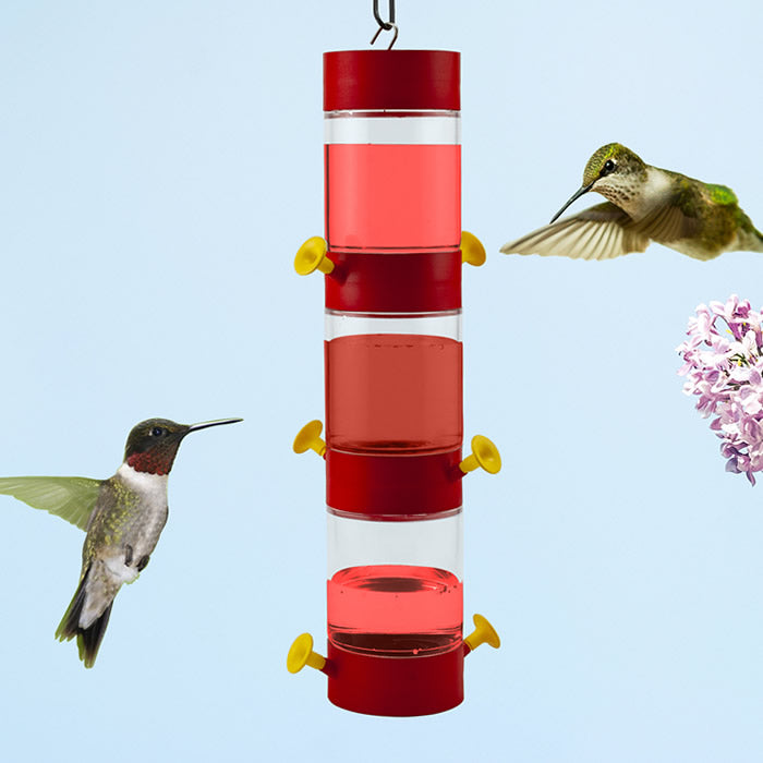 Modular Hanging Plastic Hummingbird Feeder, Set of 3, with two yellow feeding ports per unit, attracting hummingbirds near bird feeder.