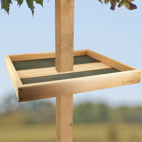 Post Seed Tray with 4x4 Mounting Bracket: A wooden bird feeder on a pole, featuring a metal mesh drainage tray for easy cleaning and reducing seed waste.