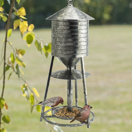 Rustic Farmhouse Galvanized Water Tower Seed Feeder with birds eating mixed seed from the wraparound perch and seed tray at the bottom.