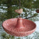 Platter Bird Feeder with circular design and rough edge, hung by brass chain, crafted from durable stoneware. Perfect for bird seed dining.