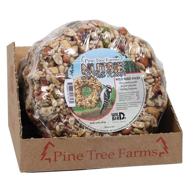 Le Petit Nutsie Wreath in a plastic bag within a box, featuring premium nuts and seeds designed to attract and energize a variety of birds year-round.