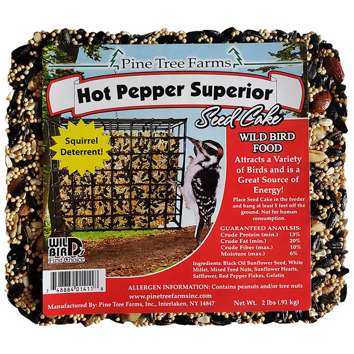 Hot Pepper Superior Blend Seed Cake, Large, in a square package, designed to attract a variety of birds and deter squirrels, visible on a metal structure.