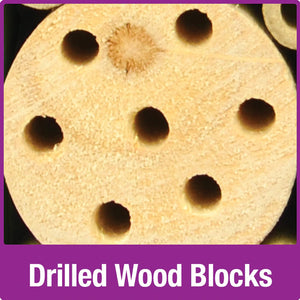 Pollinator Tower close-up showing pre-drilled wood block. Designed to attract bees and birds, providing natural pest control and pollination for your garden.