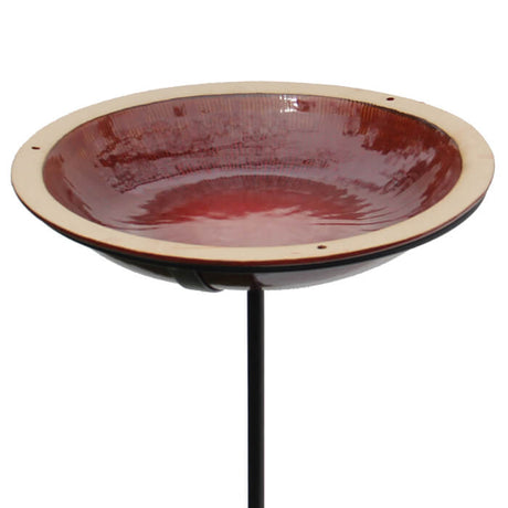 Post Radial Bird Bath, Autumn Red: Stoneware birdbath with a reflective glaze, concentric circle design, and a 14-inch basin. Includes a durable steel pole with a three-pronged foot stake.