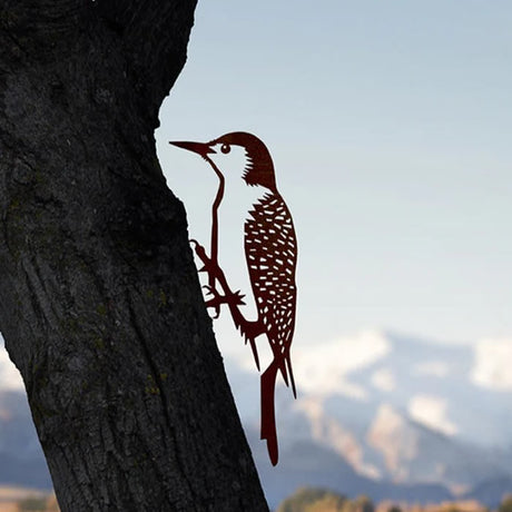 Metal Red-Bellied Woodpecker sculpture perched on a tree, crafted from durable Corten Steel, showcasing precision-cut details and designed for easy installation in gardens.