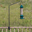 Adjustable Extended Clamp Deck Bracket with a bird feeder on a green pole, featuring birds perched, ideal for eye-level bird watching.