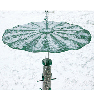 Extra Large Hanging Disk Squirrel Baffle, Green, covered in snow, features a metal hook and is designed to prevent squirrels from accessing bird feeders.