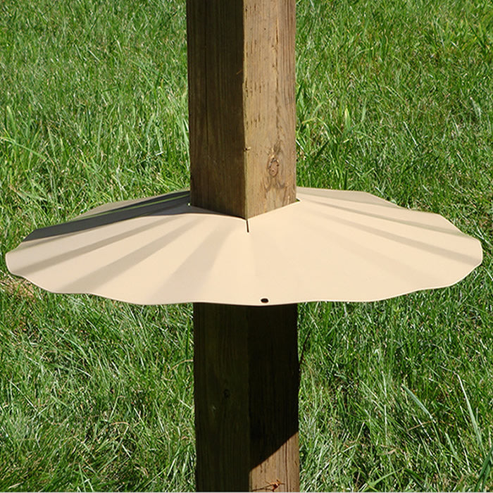 4 x 4 Post Disk Baffle, Tan, shown wrapped around a wooden post, designed to prevent squirrels from climbing to bird feeders.