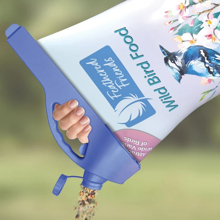 Hand holding the Handle It Bag Clip, designed for sealing and pouring from large bags of birdseed or pet food with ease.