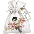 Chickadee Cherry Blossom Sack Of Soap: Linen bag adorned with embroidered bird on a branch with flowers, containing a lily of the valley scented soap bar.