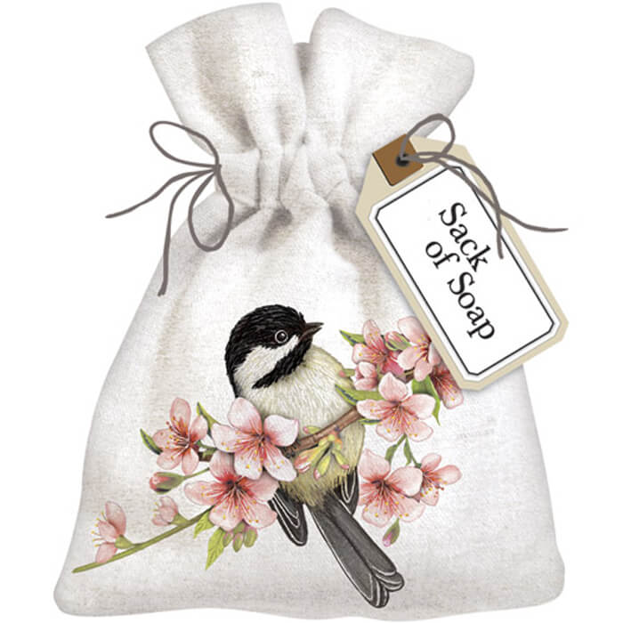 Chickadee Cherry Blossom Sack Of Soap: Linen bag adorned with embroidered bird on a branch with flowers, containing a lily of the valley scented soap bar.