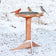 Western Red Cedar Heated Bird Bath with three songbirds perched on the rim, set in a snowy yard, showcasing its insulated design for winter use.